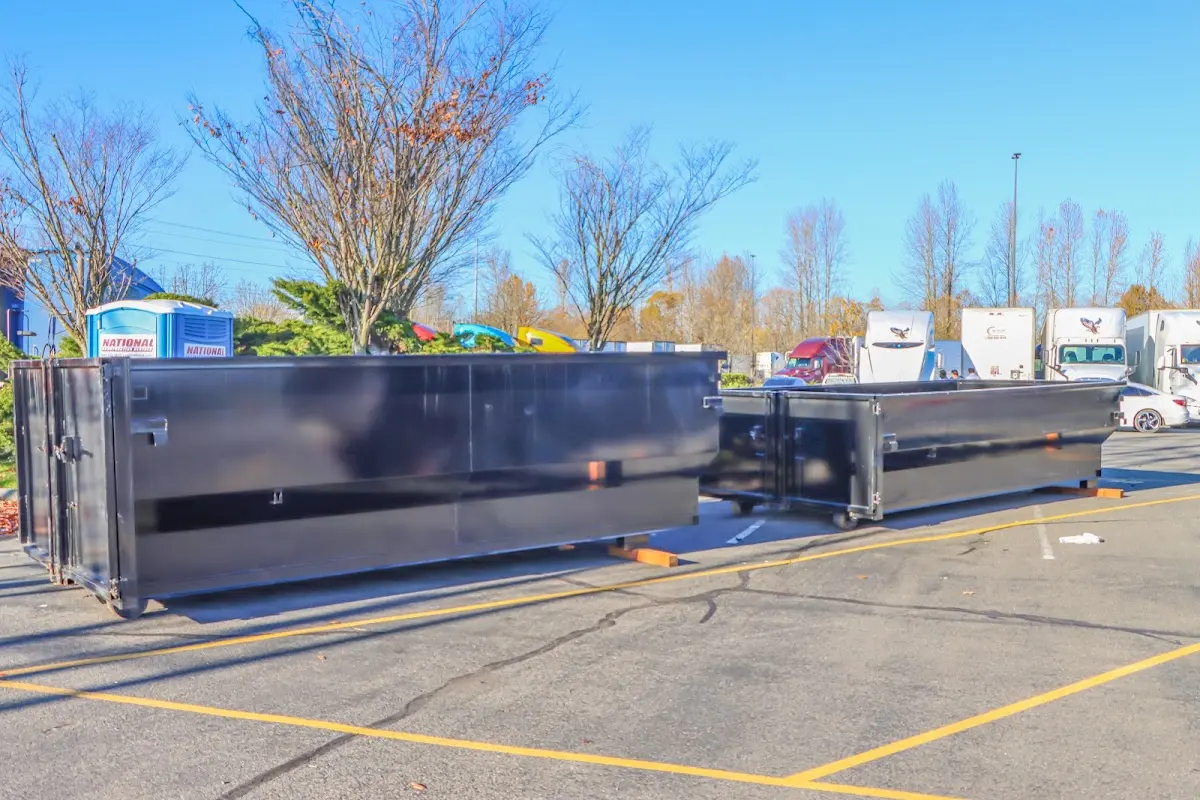 Professional dumpster rental service with roll-off container on residential driveway in Truckee